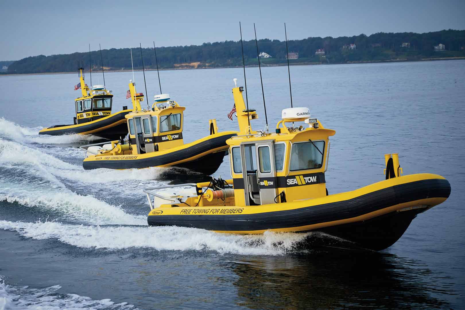 Sea Tow Fleet of Tow Boats helping a commercial boat towing Sea Tow. member.