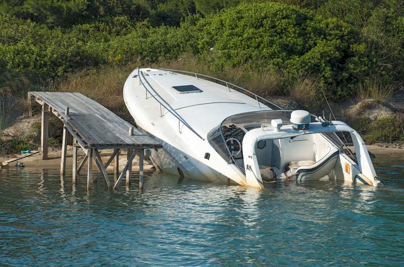 sunk boat at dock