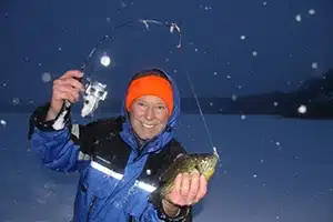 tom schlichter ice fishing on pond